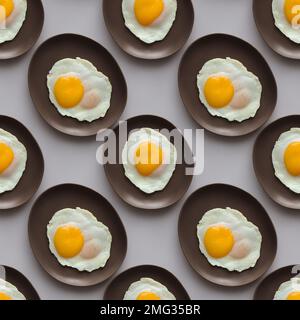 Background from Fried eggs on a ceramic saucer. 3D rendering. Seamless background Stock Photo