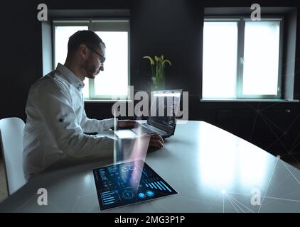 Businessman trading online stock market concept or forex investment exchange. Bitcoins, futures. Crypto currency chart with values moving up and down, trading statistics and analytics on laptop screen forex background Binar. stockbroker. checking price chart on digital exchange. Forex trading agency worker agent reviewing profits growth. Another crisis is coming and prices on the charts are falling down. finance business stock exchange graph chart, crypto, blockchain data analytics report analyzing. business man working on financial report. High quality photo Stock Photo