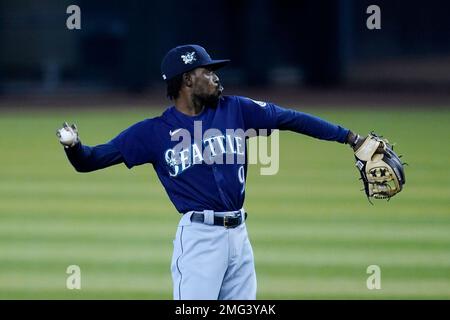 Seattle Mariners' Dee Strange-Gordon adjusts his batting helmet