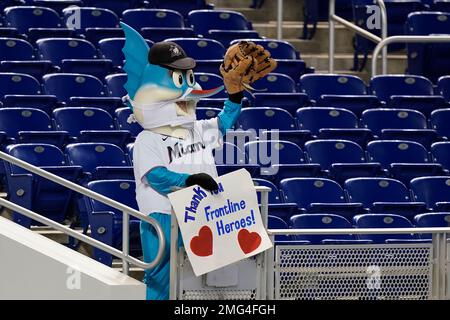 Miami Marlins Mascot Billy the Marlin celebrates on the dugout after the  2nd inning against the New York Yankees in their first exhibition game at  the new Marlins Ball Park April 1