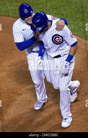 The Chicago Cubs' Anthony Rizzo, left, is congratulated by teammate Bryan  LaHair (6) following his two-run home run against the Houston Astros in the  fifth inning at Wrigley Field in Chicago, Illinois