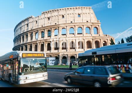 Traffic passing in front of the Colosseum in Rome Italy Stock Photo