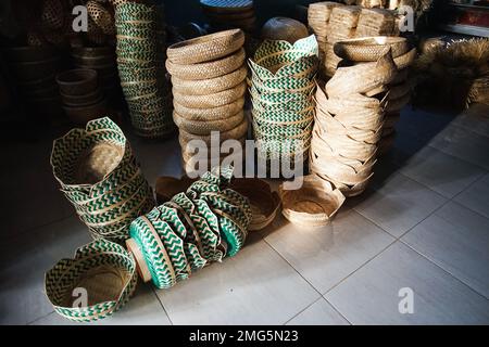 Traditional bamboo woven boxes called Besek in a warehouse at Brajan Bamboo Handicraft village, Yogyakarta, Indonesia ready to be exported abroad. Stock Photo