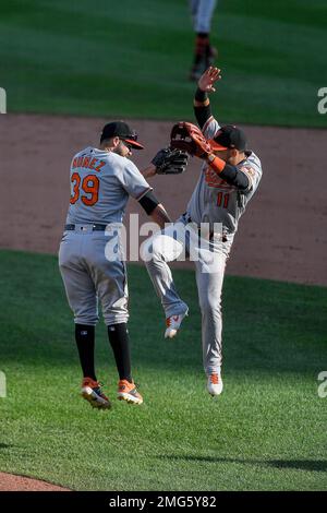 Baltimore Orioles' Renato Nunez, left, is greeted near home plate