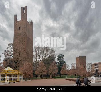 The winter face of Rovigo downtown. The medieval towers in piazza Matteotti against a cloudy sky. Rovigo, Veneto, Italy. Stock Photo