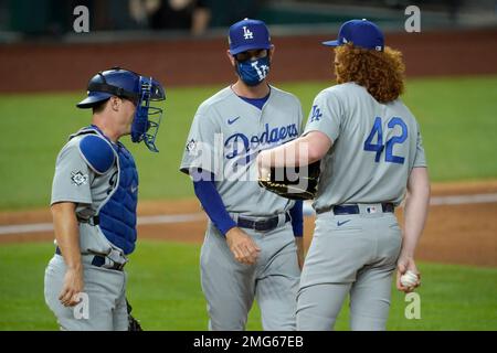 Pitching coach Mark Prior of the Los Angeles Dodgers speaks with relief  pitch Alex Wood (57) as catcher Austin Barnes (15) looks on against the  Colorado Rockies in the ninth inning of