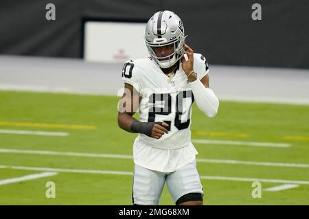 Las Vegas Raiders cornerback Damon Arnette (20) adjusts his headband during  a practice session …