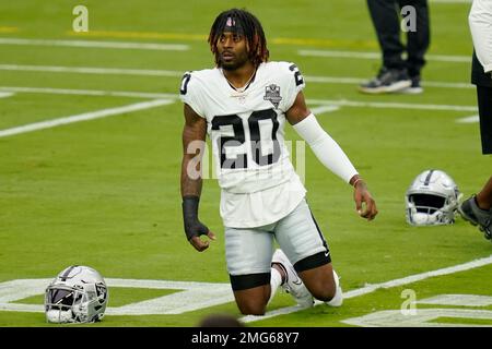 Las Vegas Raiders cornerback Damon Arnette (20) adjusts his headband during  a practice session …