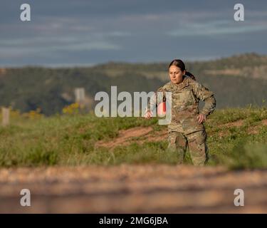 2nd Lt. Antonella Peterson, an Army health service admin assigned to 704th Brigade Support Battalion, 2nd Stryker Brigade Combat Team, 4th Infantry Division, runs back to SKED drag lane after completing a 400 meters run during the physical fitness assessment part of the Expert Field Medical Badge (EFMB) Testing, Aug 22-26, 2022, at Wilderness Readiness Complex in Fort Carson, Colorado. The EFMB test measures the individual medical Soldier’s physical fitness, mental toughness, ability to perform to standards of excellence in a broad spectrum of critical medical and Soldier skills. Stock Photo