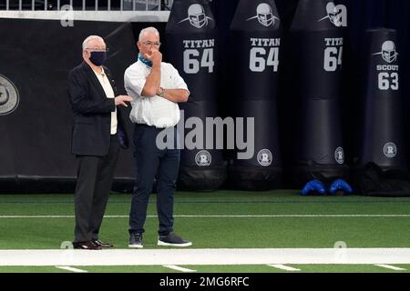 Dallas Cowboys Executive Vice President Jerry Jones Jr., left, and Chief  Operating Officer Stephen Jones, right, on the field before the start of an  NFL football game against the Washington Redskins, Sunday