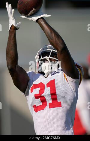 Kansas City Chiefs cornerback Chris Lammons (29) breaks up a pass intended  for Washington Commanders wide receiver Dyami Brown during the second half  of an NFL preseason football game Saturday, Aug. 20