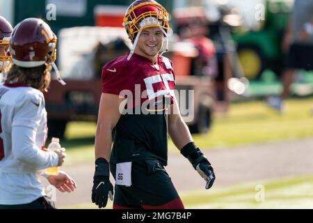 Landover, United States. 25th Oct, 2020. Dallas Cowboys quarterback Andy  Dalton (14) evades Washington Football Team linebacker Cole Holcomb (55)  during the first half of an NFL football game at FedEx Field