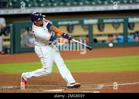 Martin Maldonado of the Houston Astros hits an RBI single in the second  inning of Game 2 of the World Series against the Atlanta Braves on Oct. 27,  2021, at Minute Maid