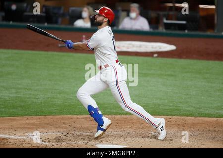 Texas Rangers' Todd Frazier follows through on a home run swing