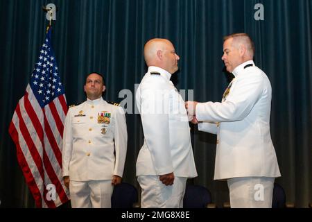 Capt. Charles McLenithan, right, commander, Submarine Squadron