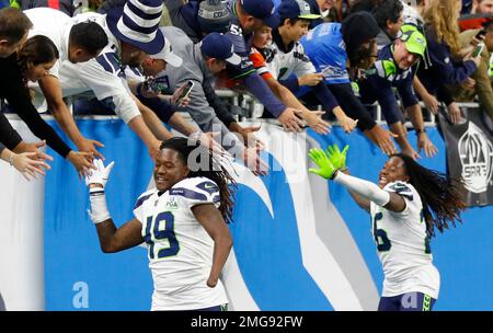 Detroit Lions players shake hands with fans after they defeated the San  Diego Chargers in Detroit on December 24, 2011. The Lions beat the Chargers  38-10. With the win the Lions clinch