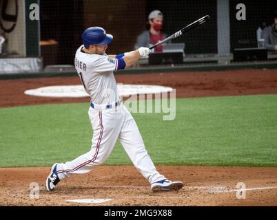 Texas Rangers' Todd Frazier follows through on a home run swing