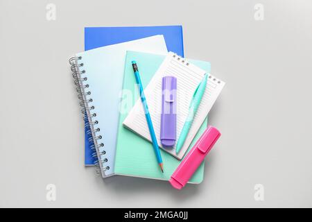 Notebooks, pen, pencil and markers on light background Stock Photo