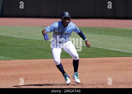 Seattle Mariners' Kyle Lewis leads off of first base after hitting a single  against the Texas Rangers during the second inning of a baseball game  Saturday, May 29, 2021, in Seattle. (AP