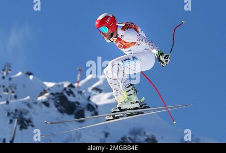 FILE - In this Feb. 13, 2014, file photo, United States' Bode Miller makes a jump during men's downhill combined training at the Sochi 2014 Winter Olympics, in Krasnaya Polyana, Russia. Bode Miller is launching a winter sports academy to help produce the next wave of standouts on the snow. Miller’s partnering with the Institute for Civic Leadership Academy to open an online learning program geared toward students in grades 7-12. (AP Photo/Luca Bruno, File)