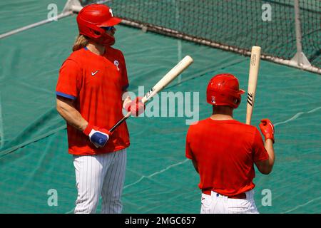 Philadelphia Phillies' Bryce Harper, left, celebrates with teammate Rhys  Hoskins after hitting …