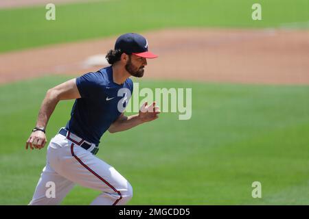 The Braves' Dansby Swanson high fives teammates prior to a game against the  Arizona Diamondbacks on Monday, Aug…