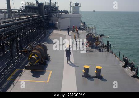 Coast Guard Cutters - Dauntless (WMEC 624) - 26-HK-73-9. CGC Dauntless -- Coast Guardsmen and civilian crew members on deck of commercial vessel -- 050928. Hurricane Katrina Stock Photo