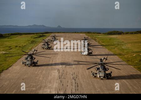 U.S. Marine Corps CH-53E Super Stallions assigned to Marine Heavy Helicopter Squadron (HMH) 361 land on a flight line for a photo during a training exercise at Ie Shima, Okinawa, Japan, Aug. 23, 2022. HMH-361 launched 6 CH-53E Super Stallions in support of the squadron’s required annual training. Stock Photo