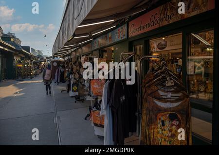 View of a Souvenir shop selling winter clothes, colorful magnets, stuffed toys and collectibles captured at Naschmarkt, Vienna, Austria. Stock Photo