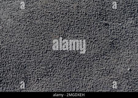 Sand surface with traces of raindrops closeup. Nature texture background Stock Photo