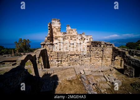 Walls and arches of a former basilika, historical remains and ruins of the Area archeologica di Tindari. Stock Photo
