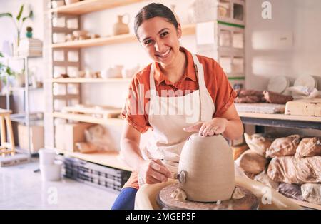 Pottery wheel, workshop portrait and happy woman design sculpture mold, studio manufacturing or art product. Creative, vase molding or startup small Stock Photo