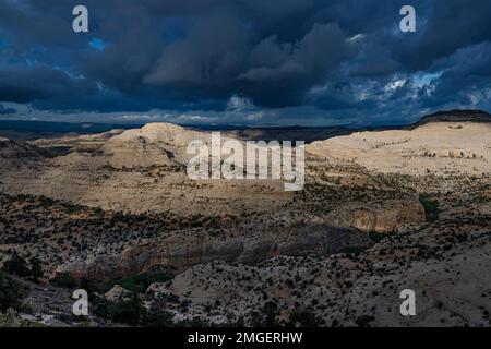 Storm clouds spread over buttes in Escalante Grand Staircase National Monument, Garfield County, Utah Stock Photo