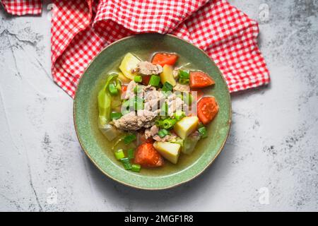 Sop Daging is Indonesian clear soup with beef and vegetables Stock Photo