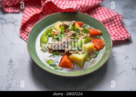 Sop Daging is Indonesian clear soup with beef and vegetables Stock Photo