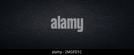 Beautiful texture of a fine black leather surface using as background or header Stock Photo