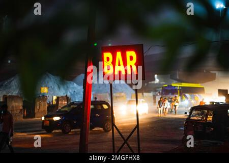 Bar light sign board in red color, neon sign for a bar,Bar neon sign,neon BAR sign lights up the doorway of a drinking establishment at night, a place Stock Photo