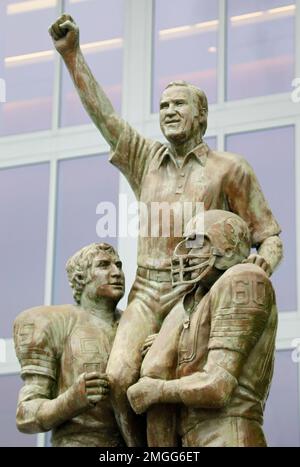 FILE - Former Miami Dolphins 1972 players Bob Griese (12) and Earl Morrall  (15) enjoy a half time celebration honoring the 1972 undefeated team at an  NFL football game against the Jacksonville