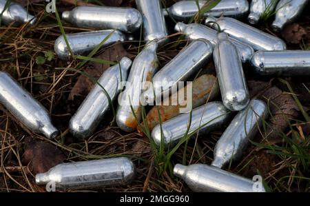 File photo dated 13/01/20 of canisters of nitrous oxide, or laughing gas, discarded by the side of a road near Ebbsfleet, Kent. Ministers are reportedly planning to ban the sale and possession of what is known as laughing gas as part of a bid to tackle antisocial behaviour. Issue date: Thursday January 26, 2023. Stock Photo