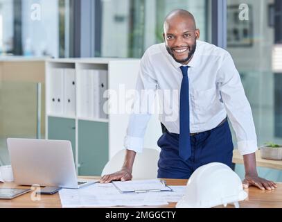 Portrait, black man and architect in office, laptop and achievement with startup, manager or smile. Nigerian male employee, confident leader or Stock Photo
