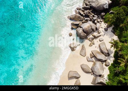 Drone view from above at a tropical beach in the Seychelles Mahe Island Stock Photo