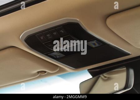 Car ceiling lamp in a car. Modern car interior lights close-up. Stock Photo