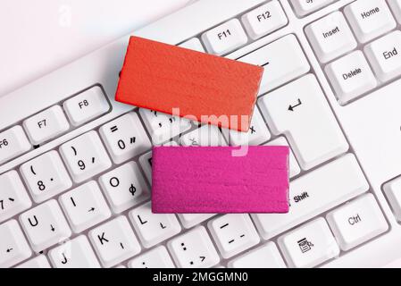 Colored cube with important message lying on keyboard. Main information. Stock Photo