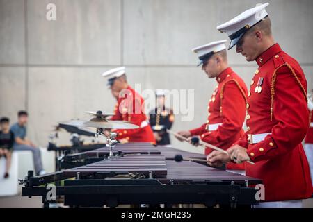 Marines with “The Commandant’s Own”, U.S. Marine Drum and Bugle Corps, perform at the National Museum of the Marine Corps, Quantico, Virginia, Aug. 24, 2022. “The Commandant’s Own,” performed multiple songs to showcase esprit de corps and honor the generations before us. Stock Photo
