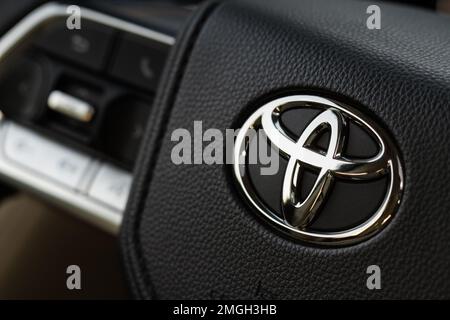 MOSCOW, RUSSIA - DECEMBER 11, 2021 Toyota Land Cruiser 300 (J300) steering wheel close up view. Toyota logo on the car steering wheel. Full-size luxur Stock Photo