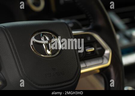 MOSCOW, RUSSIA - DECEMBER 11, 2021 Toyota Land Cruiser 300 (J300) steering wheel close up view. Toyota logo on the car steering wheel. Full-size luxur Stock Photo