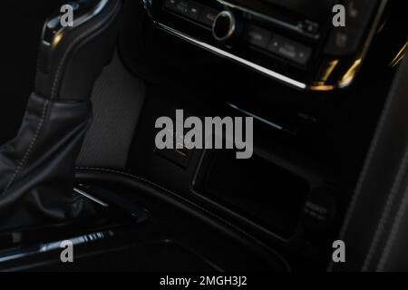 MOSCOW, RUSSIA - DECEMBER 11, 2021 Infiniti QX80 (QX56) USB port in the car panel close up. Car interior detail. Car usb charger detail. Stock Photo