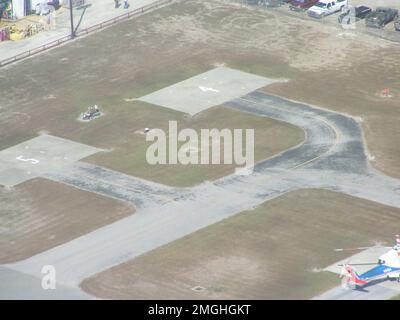 Aftermath - Jefferson Parish - 26-HK-38-64. small airport runway with aircraft visible. Hurricane Katrina Stock Photo