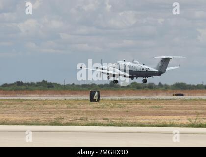 An MC-12W assigned to the 137th Special Operations Wing, Oklahoma National Guard, departs from San Angelo Regional Airport-Mathis Field, Texas, Aug. 24, 2022. The MC-12W is a twin-engine turbo prop aircraft used for intelligence, surveillance and reconnaissance missions in support of ground forces around the world. Stock Photo