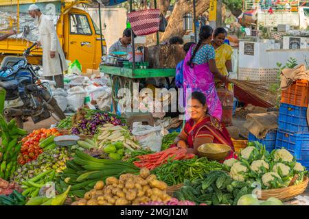 Puttaparthi, Andra Pradesh - India - January 21.2023: Women selling vegetables on the local Indian market Stock Photo